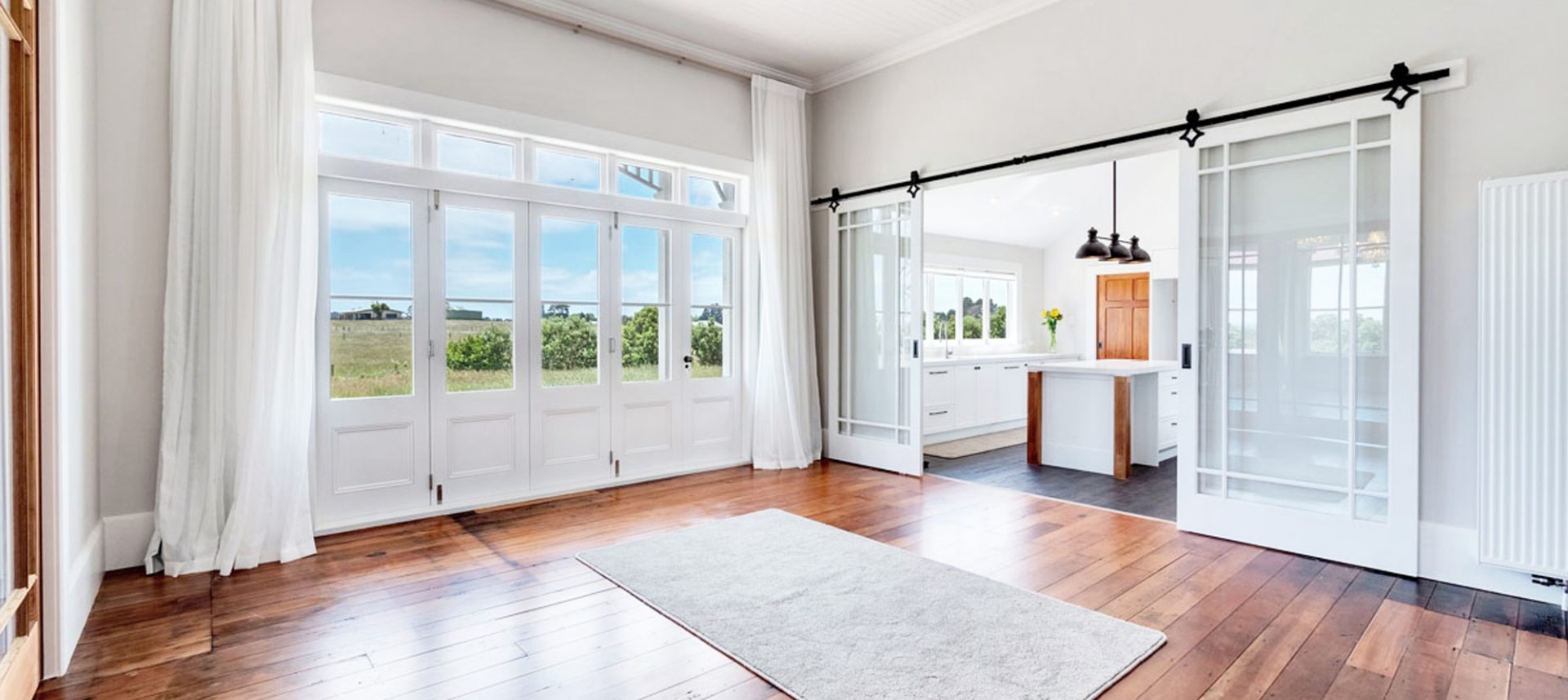 Heritage house freshly painted with white internal walls and wooden floors